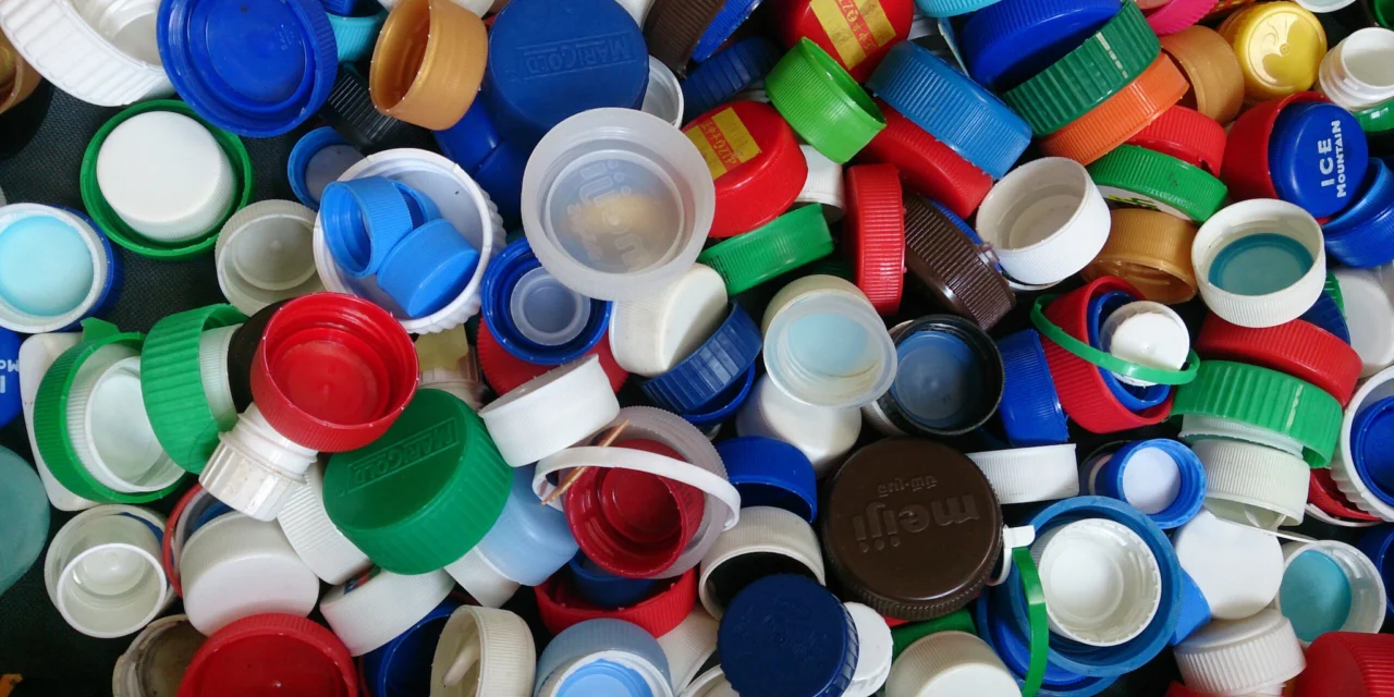 What are the key regulations and standards that govern the production of bottle caps and lids for food and beverage containers?