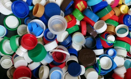 What are the key regulations and standards that govern the production of bottle caps and lids for food and beverage containers?