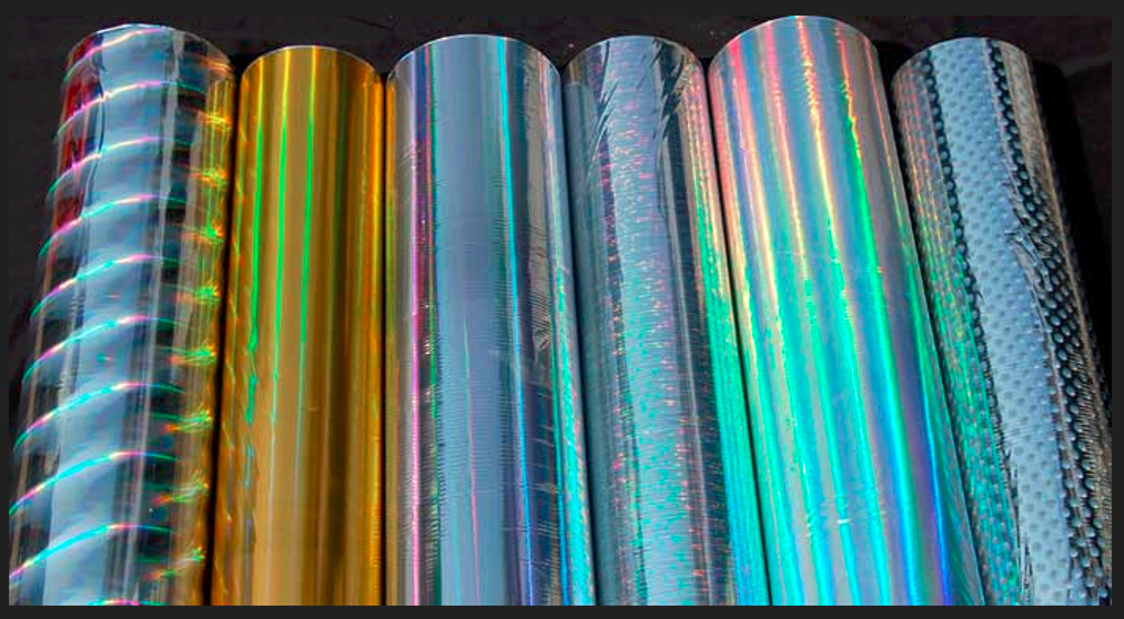 What are holographic films, and how are they integrated into plastic and rubber products?